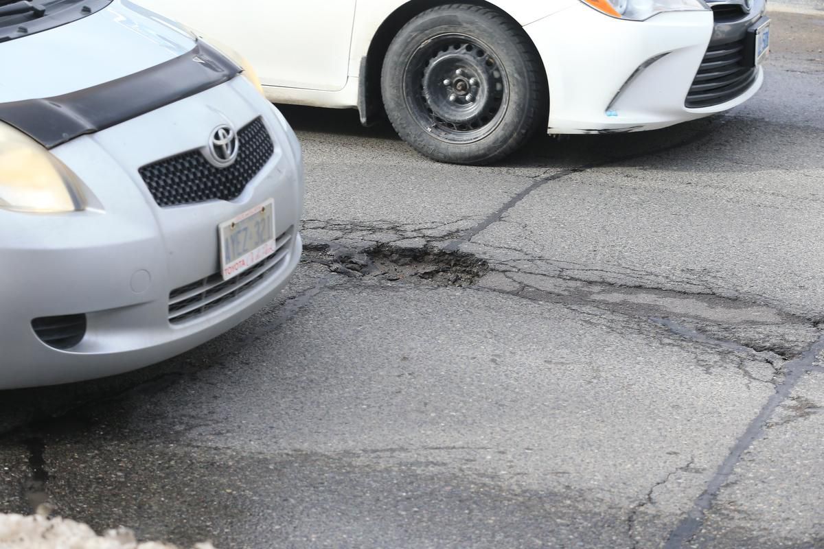 How do I file a claim for pothole damage with the city?