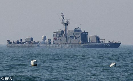 Korea tensions over claims that warship was sunk by torpedo