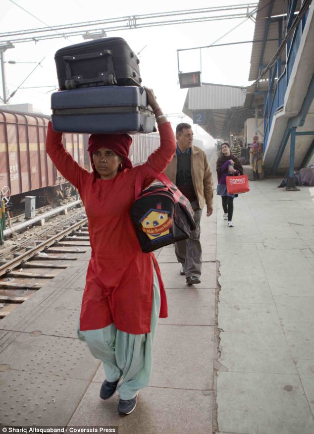 Maya, the only female porter in Ludhiana, carries bags for a few rupees to pay for her son, 12