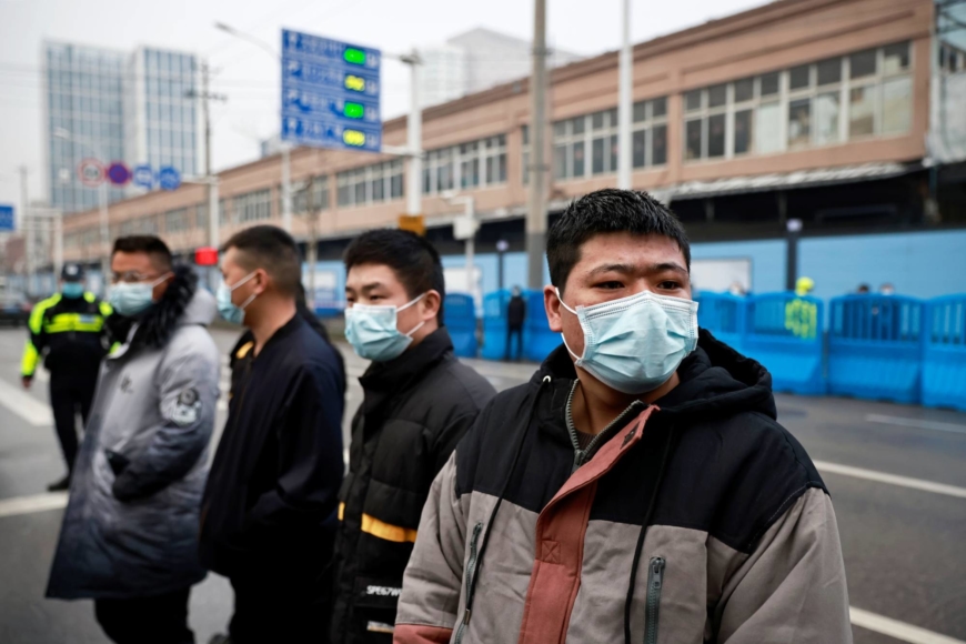 WHO probe team visits Wuhan market at heart of first virus outbreak