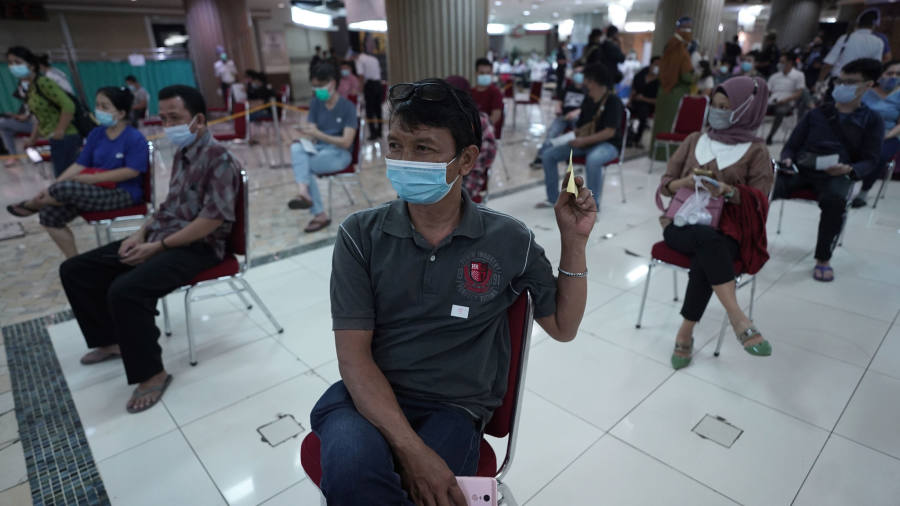 Coronavirus latest: Vaccine dodgers face fines as Indonesia makes inoculation compulsory