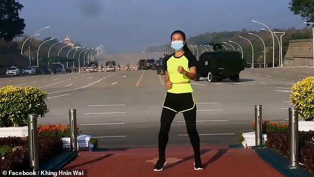 Myanmar coup: Woman performs exercise video without noticing troops behind her