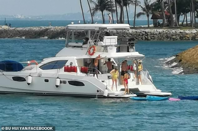 Nine Britons are charged over Singapore yacht party that broke coronavirus rules