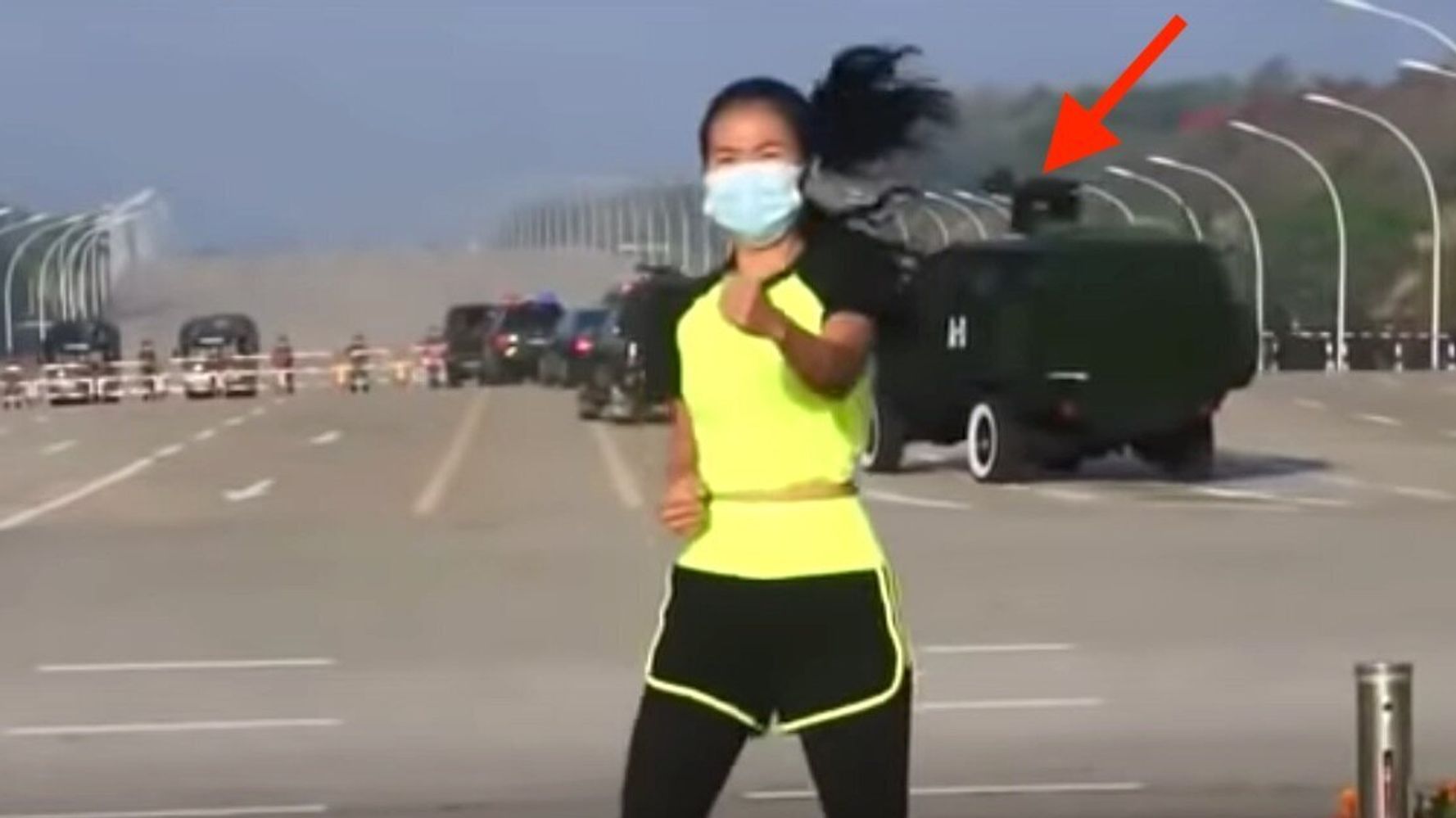 Woman Calmly Teaches Aerobics Class As Military Coup Unfolds Behind Her