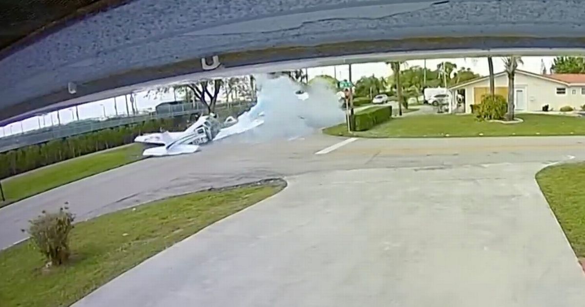 Horrifying moment plane plummets and crashes into car before erupting in ball of flames