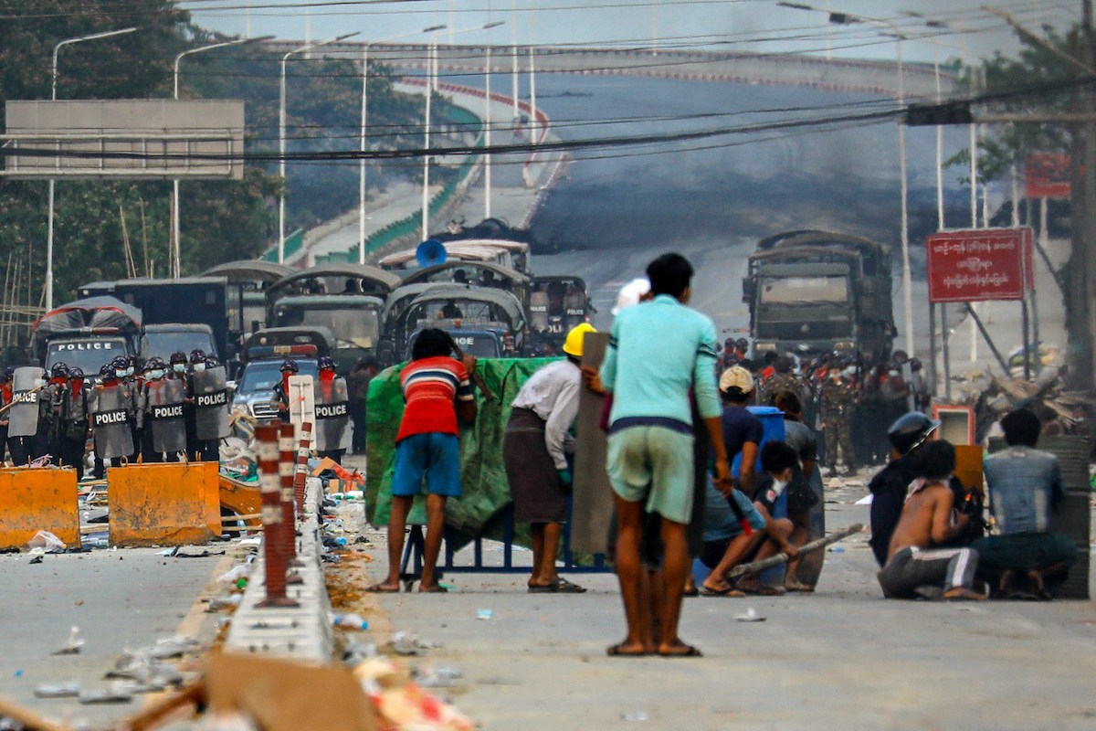 Town a battle zone as Myanmar enforces martial law