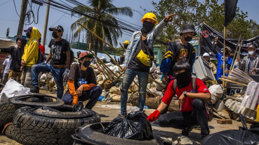 Myanmar protesters voice defiance under cover of the night