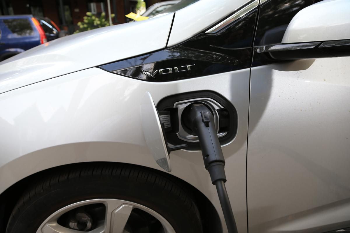 Who should be investing in the creation of a charging infrastructure for electric vehicles?