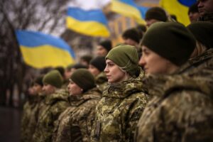 Ukrainian Army soldiers pose for a photo as they gather to celebrate a Day of Unity in Odessa, Ukraine, Wednesday, Feb. 16, 2022. (AP Photo/Emilio Morenatti) 