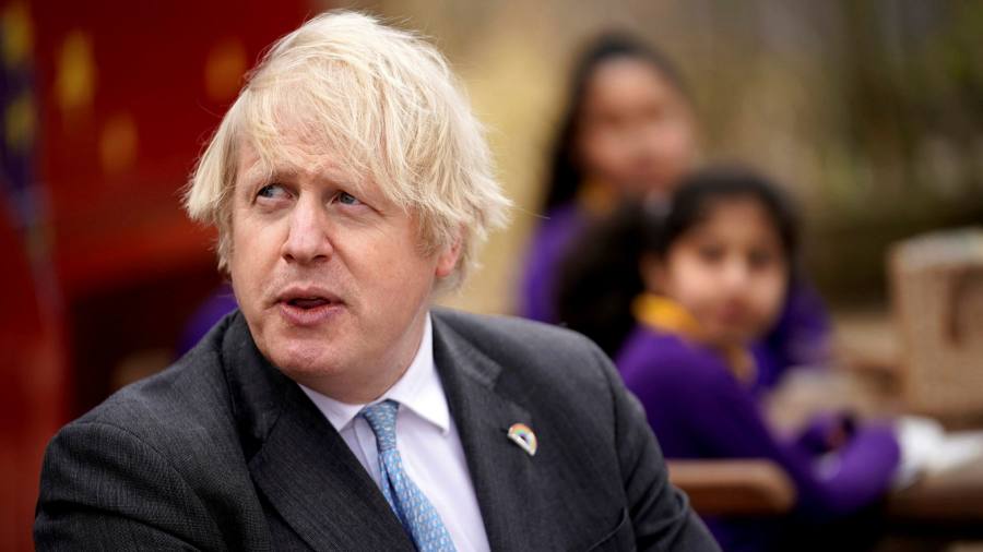 Boris Johnson defends UK border regime amid hunt for Covid patient