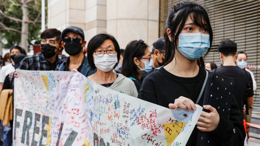 Hong Kong activists chant protest slogans as crowds gather for subversion hearing