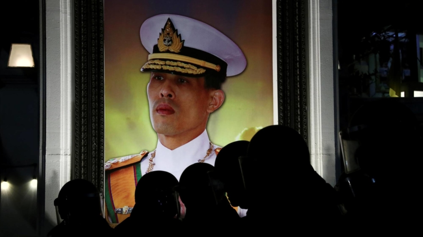 Thai activist accused of burning king’s portrait arrested